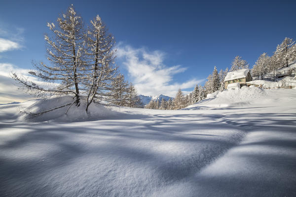 The Pietro Crosta Hut after a snowfall in winter (Alp Solcio, Varzo, Verbano Cusio Ossola province, Piedmont, Italy, Europe)