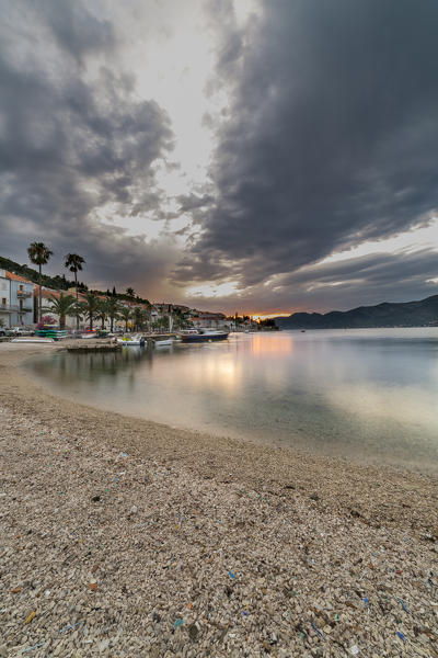 Sunset from the beach of Korcula village (Korcula, Korcula Island, Dubrovnik-Neretva county, Dalmatia region, Croatia, Europe)