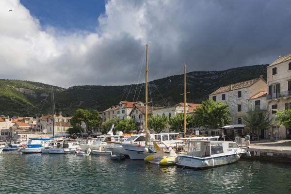 View of Komiza village and its port (Komiza, Vis, Vis Island, Split-Dalmatia county, Dalmatia region, Croatia, Europe)