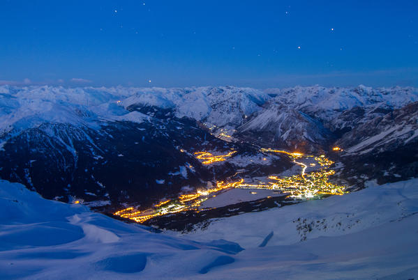 Europe, Italy, Lombardy. Bormio town after a winter snowfall by night, Alps