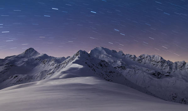 Europe, Italy, Lombardy, Sondrio. Cima Piazzi mountains in a stars winter night, Valtellina, Italian Alps