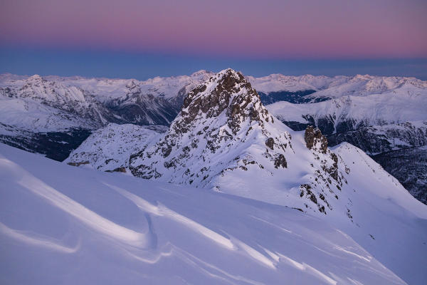 Mountain landscape from italian Alps during a winter sunrise. Forcellina mount, Viola valley, Valdidentro, Valtellina, Sondrio district, Lombardy, Italy, Europe.