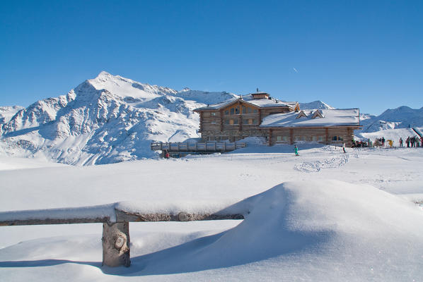 Pristine snow at Sunny Valley mountain hut. Valtellina, Lombardy, Italy.