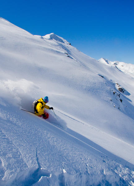 Freerider in backcountry between the fresh snow of Livigno, near the piz Canton - the area's plants Carousel 3000