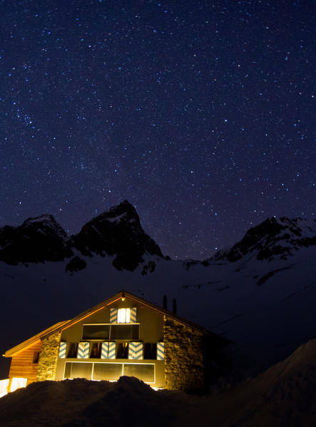 Chamanna Tuoi refuge during a starring night. Guarda, Zernez, Engadin, Switzerland, Europe