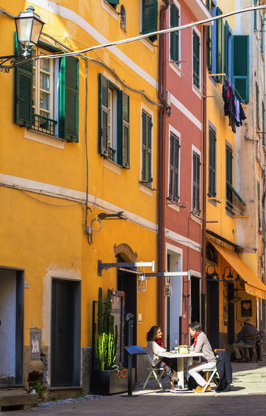 Couple eating out in the village of Monterosso al Mare, Cinque Terre, Liguria, Italy, Europe.