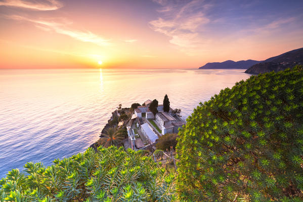 Sunset on the sea above the cemetery of Manarola, Cinque Terre, Liguria, Italy, Europe.