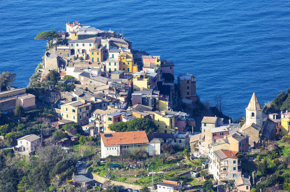 Village of Corniglia from above. Sunrise on the village of Manarola from a sea cave. Cinque Terre, Liguria, Italy, Europe.