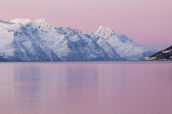Pink sunset in Kafjorden, Lyngen Alps, Troms, Norway, Lapland, Europe.