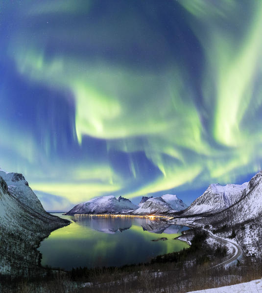 Northern lights in the night sky from panoramic point over Bergsfjorden. Bergsfjorden, Senja, Norway, Europe.