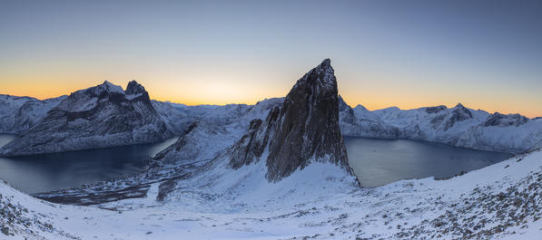 Panoramic view in the surroundings of Fjordgard with the Segla that divides Mefjorden and Ornfjorden. Hesten, Fjordgard, Mefjorden, Senja, Norway, Europe.