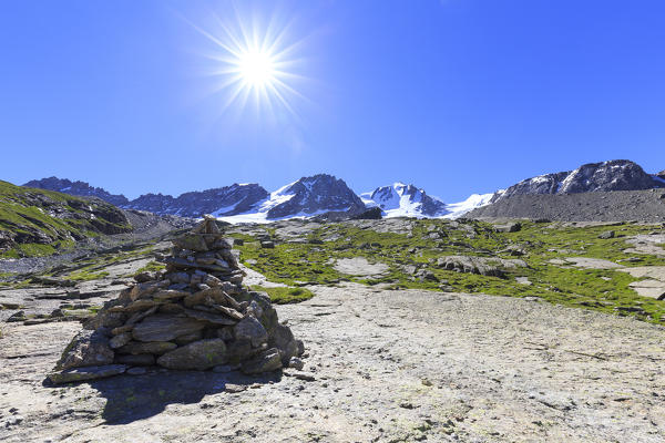 The sun shines above the summit of Gran Paradiso. Valsavarance, Gran Paradiso National Park, Aosta Valley, Italy, Europe