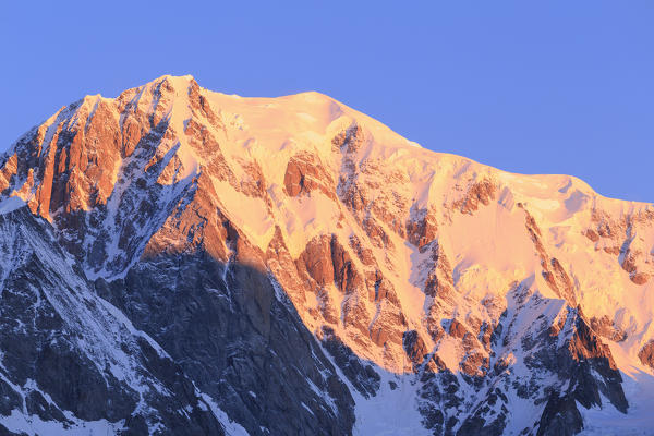 Mont Blanc illuminated by the rising sun. Ferret Valley, Courmayeur, Aosta Valley, Italy, Europe