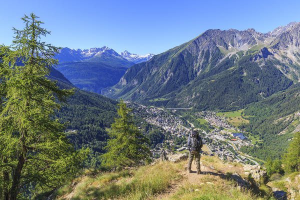 Hiker enjoy the panorama on Courmayeur. Bertone Hut, Ferret Valley, Courmayeur, Aosta Valley, Italy, Europe