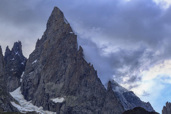 Black clouds break on the Auguille Noire de Peuterey. Veny Valley, Courmayeur, Aosta Valley, Italy, Europe