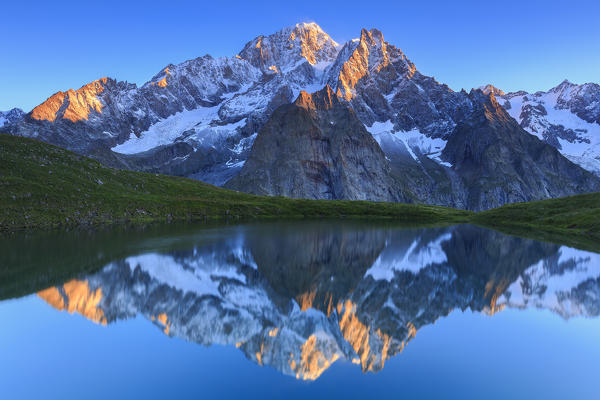 The Mont Blanc is reflected in Lac Checrouit during sunrise. Checrouit Lake, Veny Valley, Courmayeur, Aosta Valley, Italy, Europe