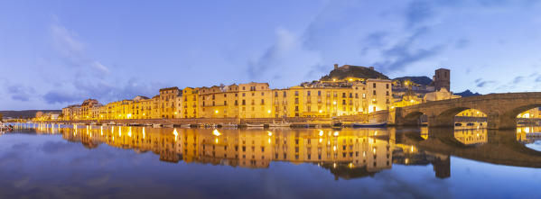 Panoramic view of the village of Bosa at dusk, Oristano province, Sardinia, Italy, Europe.