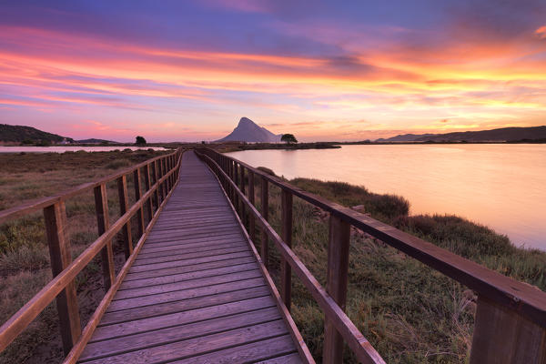 Sunrise from a pedestrian walkway. Porto Taverna, Loiri Porto San Paolo, Olbia Tempio province, Sardinia, Italy, Europe.