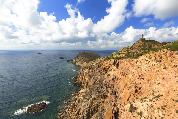 Capo Sandalo lighthouse from the cliff. San Pietro Island, Sud Sardegna province, Sardinia, Italy, Europe.
