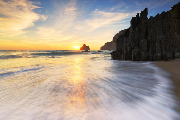 Waves at sunset on the Beach of Masua, Iglesias, Sud Sardegna province, Sardinia, Italy, Europe.