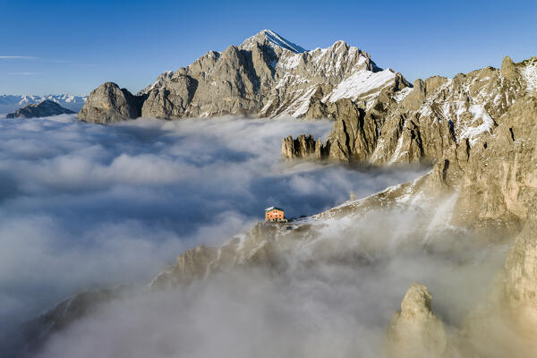 Rifugio rosalba emerge from the clouds. Grignetta, Grigne group, Lake Como, Italy, Europe