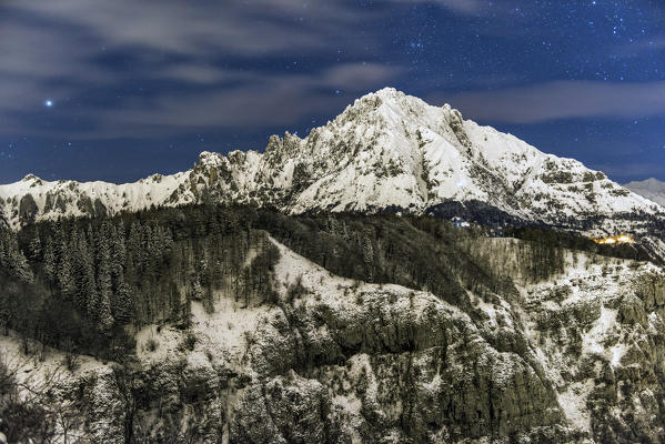 Night view of southern Grigna viewed from the snowy Coltignone mountain, Lecco province, Lombardy, Italy