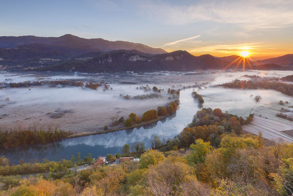 Autumn sunrise on Adda river, Airuno, Lecco province, Brianza, Lombardy, Italy, Europe