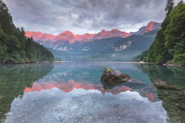 Sunrise on Tovel lake and Brenta group, Ville d'Anaunia, Non valley, Trento province, Trentino Alto Adige, Italy, Europe