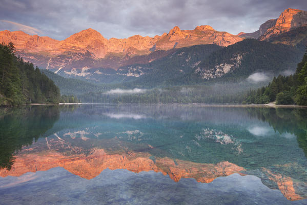 Sunrise on Tovel lake and Brenta group, Ville d'Anaunia, Non valley, Trento province, Trentino Alto Adige, Italy, Europe