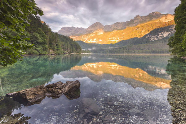 Sunrise on Tovel lake and Brenta group, Ville d'Anaunia, Non valley, Trento province, Trentino Alto Adige, Italy, Europe