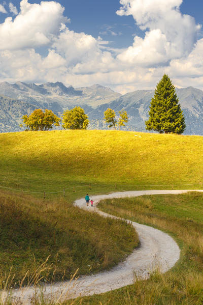 Mom with her daughter walks on the Non valley paths, Cles, Trento province, Trentino Alto Adige, Italy, Europe (MR)