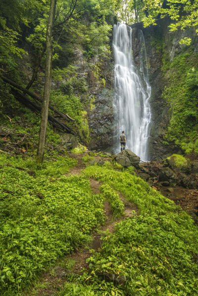 Man looks Pesegh waterfall, Brinzio, Varese province, Lombardy, Italy, Europe
