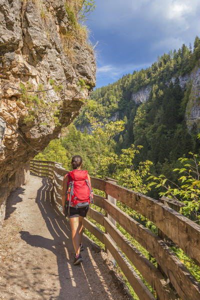 Hiker crosses the canyon to reach San Romedio monastery, sentiero delle forre, Sanzeno, Predaia, Non valley, Trento province, Trentino Alto Adige, Italy, Europe (MR)