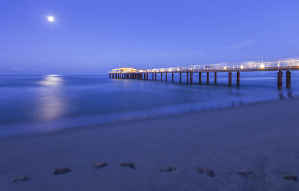 Dawn on Lido di Camaiore pier with moon, Lucca province, Versilia, Tuscany, Italy, Europe
