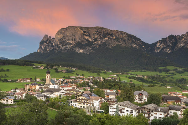 Sunset on Sciliar Dolomites and Fiè allo Sciliar village, Bolzano province, South Tyrol, Trentino Alto Adige, Italy, Europe