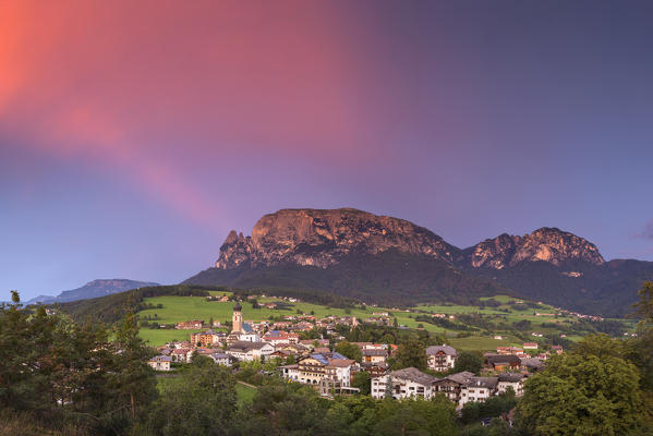 Panoramic of sunset on Sciliar Dolomites and Fiè allo Sciliar village, Bolzano province, South Tyrol, Trentino Alto Adige, Italy, Europe