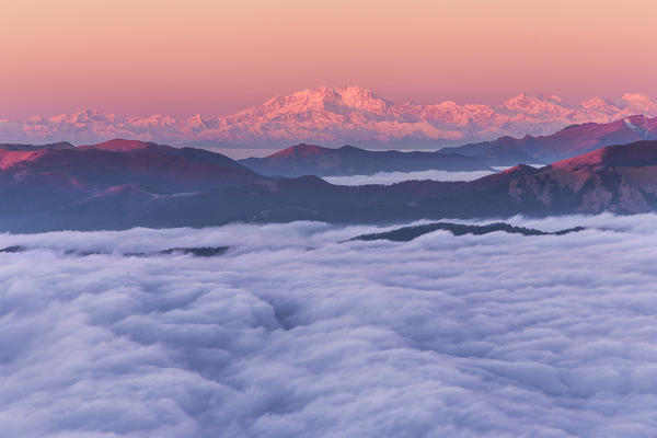 Sunrise on Rosa mount and Pennine Alps above the clouds, view from the top of Coltignone mount, Piani dei Resinelli, Lecco province, Lombardy, Italy, Europe