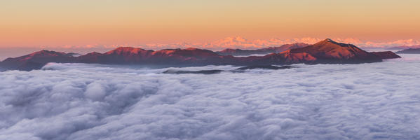 A view of Rosa mount and Alps (Pennine) and Prealps of Como province (Colma di Sormano, Boletto, Bollettone, Palanzone, San Primo) above the clouds, view from the top of Coltignone mount, Piani dei Resinelli, Lecco province, Lombardy, Italy, Europe