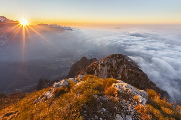 Sunrise above Lecco city from the top of Coltignone mount, Piani dei Resinelli, Lecco province, Lombardy, Italy, Europe