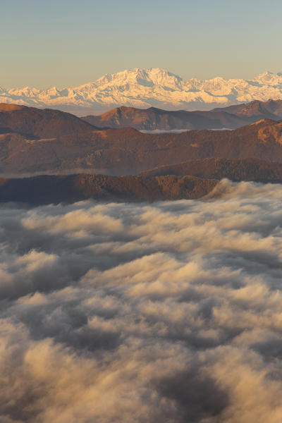 Rosa mount, Pennine Alps and Prealps of Como province above the clouds, view from the top of Coltignone mount, Piani dei Resinelli, Lecco province, Lombardy, Italy, Europe
