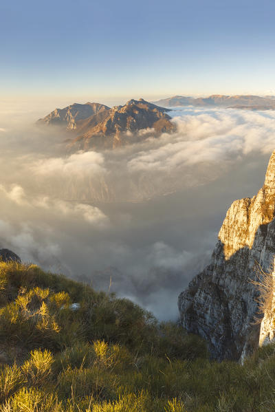 Lecco mountains (Corni di Canzo, Rai, Moregallo) wrapped of clouds, view from the top of Coltignone mount, Piani dei Resinelli, Lecco province, Lombardy, Italy, Europe