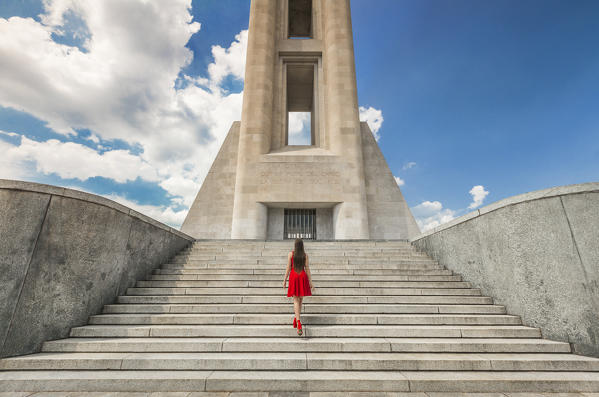 A tourist go up the stairs of War Memorial monument (Monumento ai Caduti), Como city, Lombardy, Italy, Europe (MR)