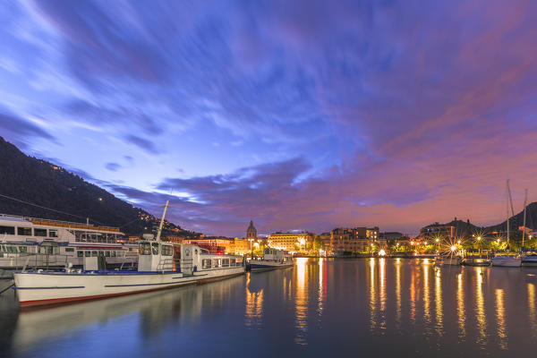 Dawn on the pier of Como, Como city illuminated, lake Como, Lombardy, Italy, Europe