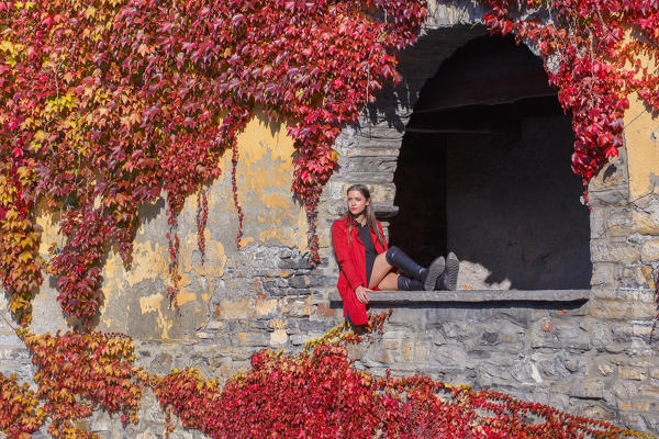 A tourist looks lake Como from Nesso village in the Autumn, Como province, Lombardy, Italy, Europe (MR)