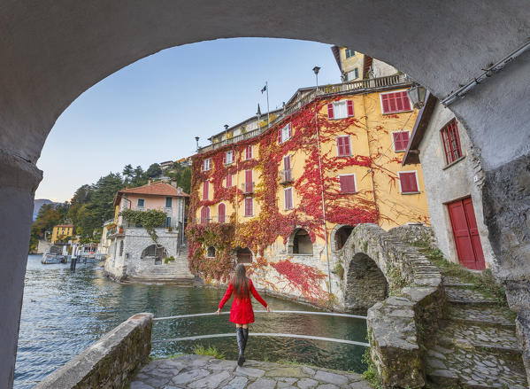 A tourist looks lake Como from Nesso village in the Autumn, Como province, Lombardy, Italy, Europe (MR)