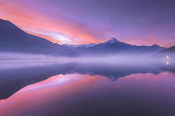 Dawn on Legnone mount (Lecco province) reflected into Mera river from Dascio village, Sorico, Riserva Naturale Pian di Spagna e Lago di Mezzola, lake Como, Como province, Lombardy, Italy, Europe