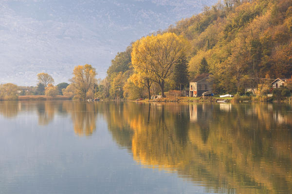 Dascio village reflected into Mera river, Sorico, lake Como, Como province, Lombardy, Italy, Europe
