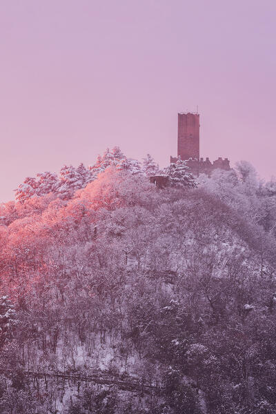 Sunset on Baradello tower (Castel Baradello) after the snowfall, Como city, lake Como, Lombardy, Italy, Europe