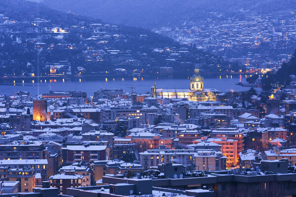 Dusk on Como city after the snowfall with Christmas Light Tree event, lake Como, Lombardy, Italy, Europe