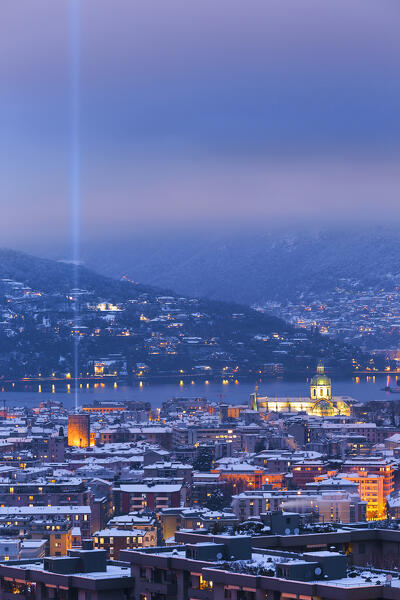 Dusk on Como city after the snowfall with Christmas Light Tree event, lake Como, Lombardy, Italy, Europe